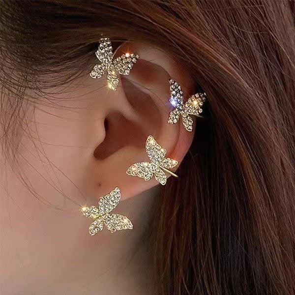 butterfly cuff earrings on ear with sparkling crystal design gold plated clip-on