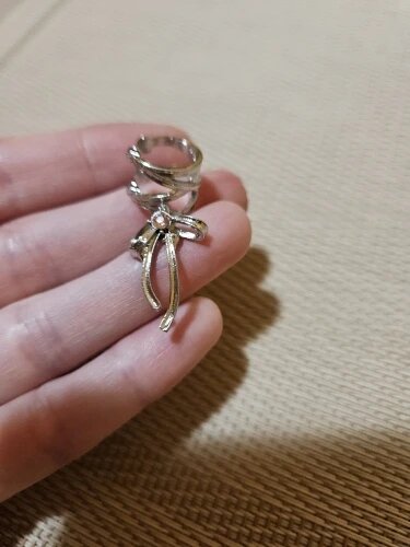 Dark Elegance Ribbon Ear Cuff with nickel-free stainless steel and satin bow design, clip-on comfort.